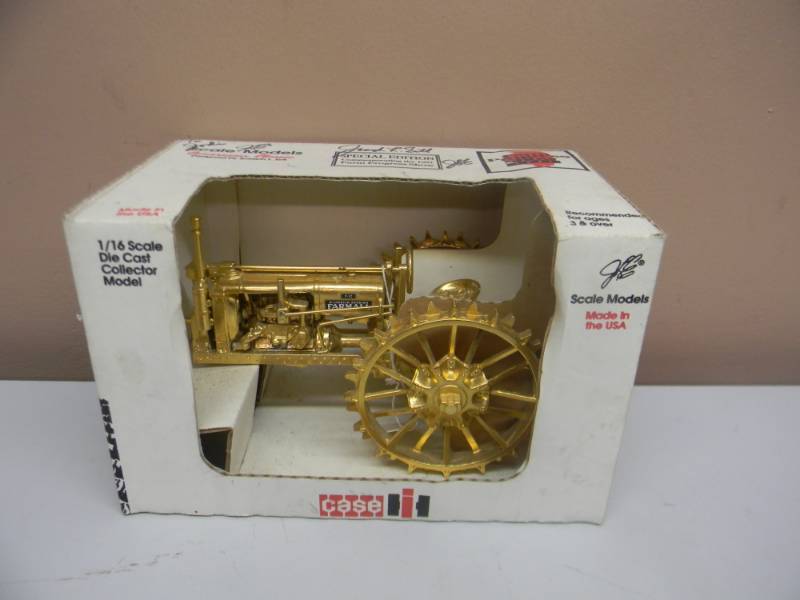 lot 13 image: CASE IH McCORMICK-DEERING F-12 FARMALL 116 SCALE DIE CAST COLLECTOR MODEL SPECIAL EDITION COMMEMORATING THE 1991 FARM PROGRESS SHOW - SIGNED BY JOSEPH L ERTL - IN BOX - GOLD PLATED - VERY RARE - SEE PICTURES