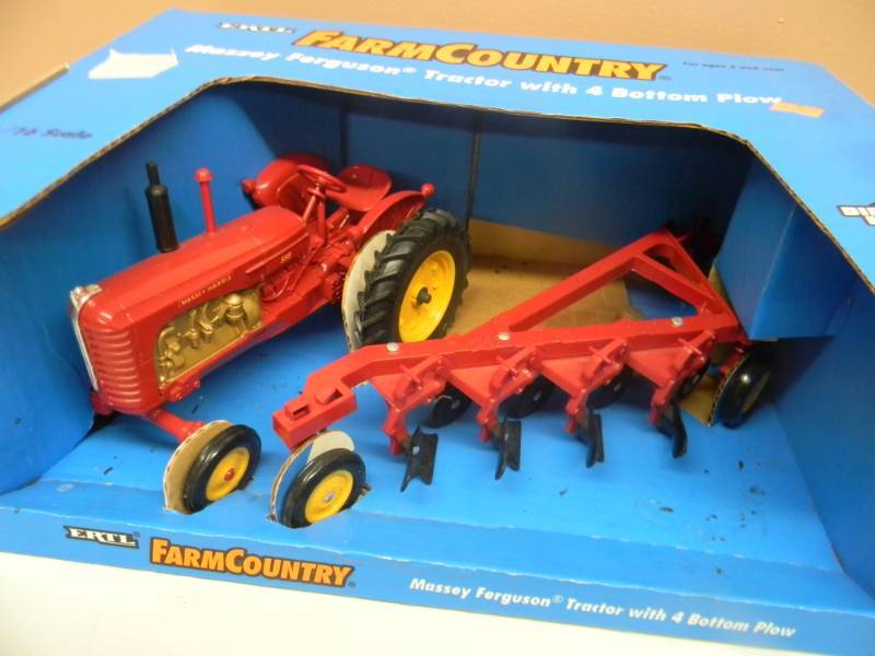 lot 23 image: VINTAGE ERTL 116 SCALE DIE CAST MASSEY HARRIS 555 TRACTOR & PLOW FARM COUNTRY - RARE - NEW IN BOX SEE PICTURES
