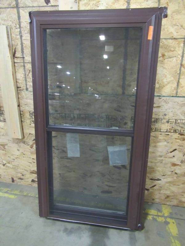 lot 262 image: Double Hung Window, Brown ExteriorWhite Vinyl Interior. Measures Approximately 32 12 X 63 X 4 916.