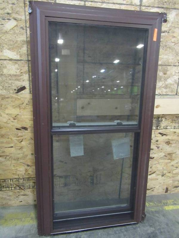 lot 263 image: Double Hung Window, Brown ExteriorWhite Vinyl Interior. Measures Approximately 32 12 X 63 X 4 916.