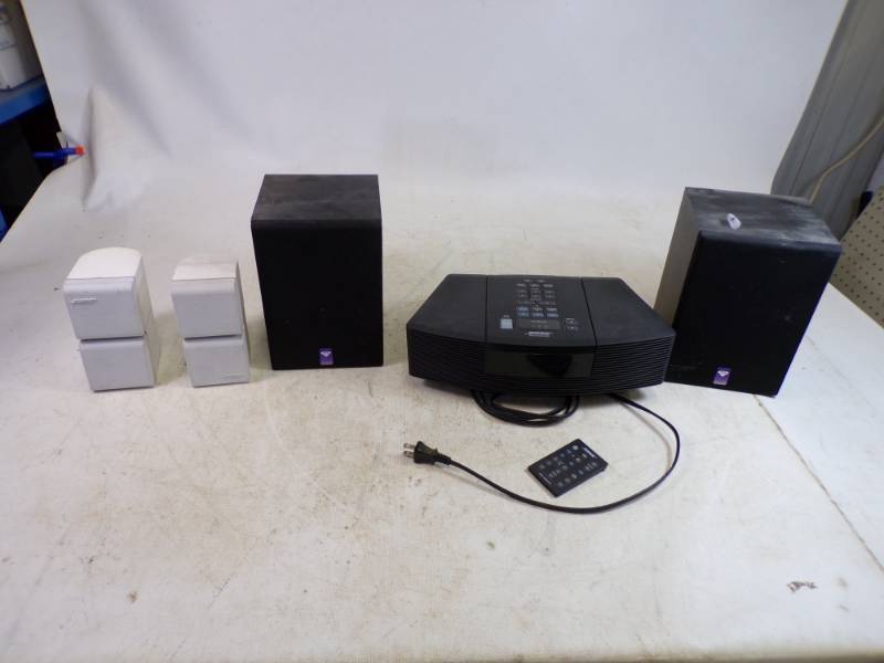 lot 75 image: Bose Wave Radio with Speakers and Outdoor Speakers