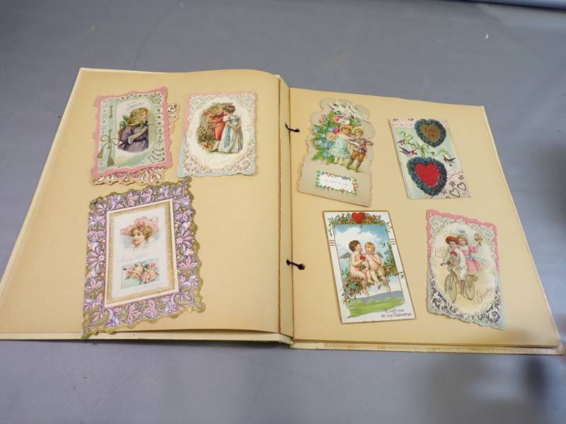 lot 57 image: Vintage Scrap Book filled with Victorian Valentines nonglued