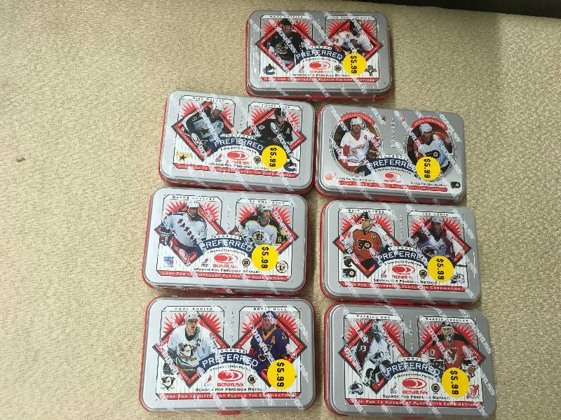 lot 77 image: Seven Donruss NHL Unopened Card Tins