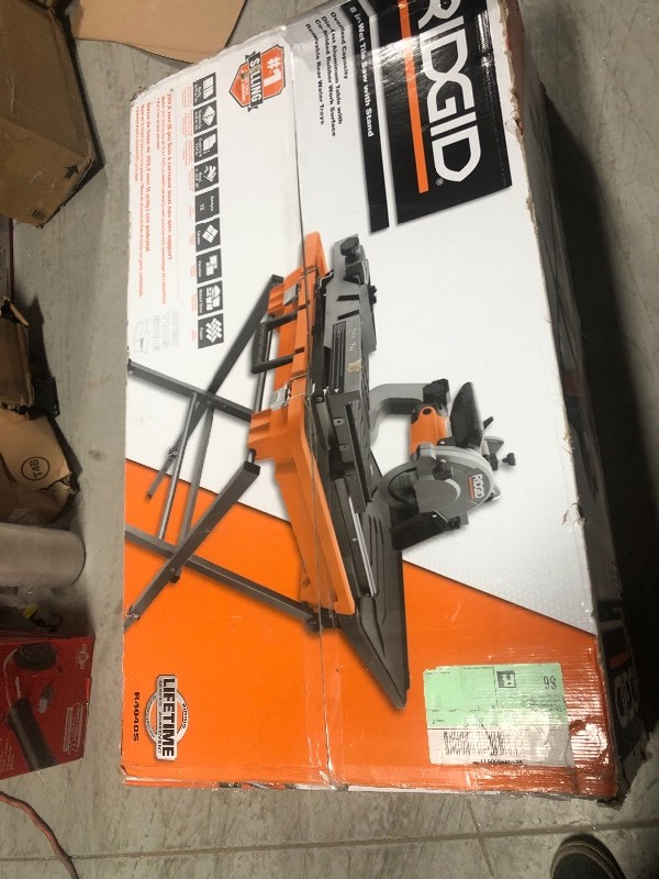 lot 110 image: RIDGID 12 Amp Corded 8 in. Wet Tile Saw with Stand in good working conditions