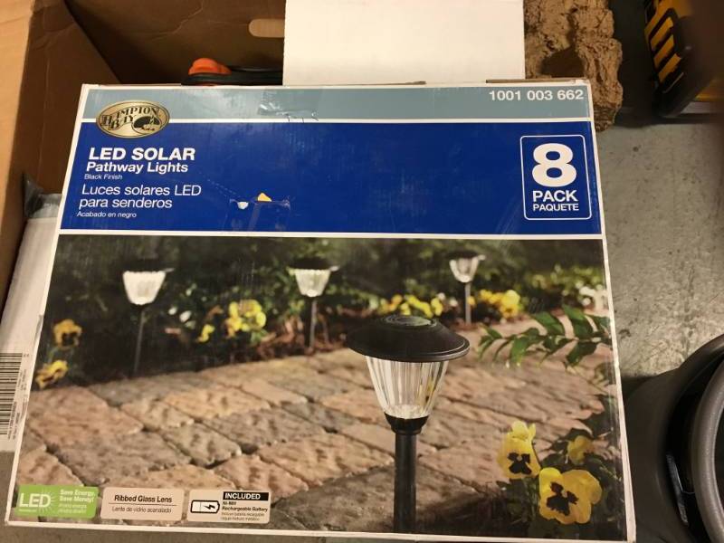 lot 83 image: Hampton Bay Solar Black Outdoor Integrated LED Landscape Path Light with Ribbed Pattern Glass Lens (8-Pack) not used