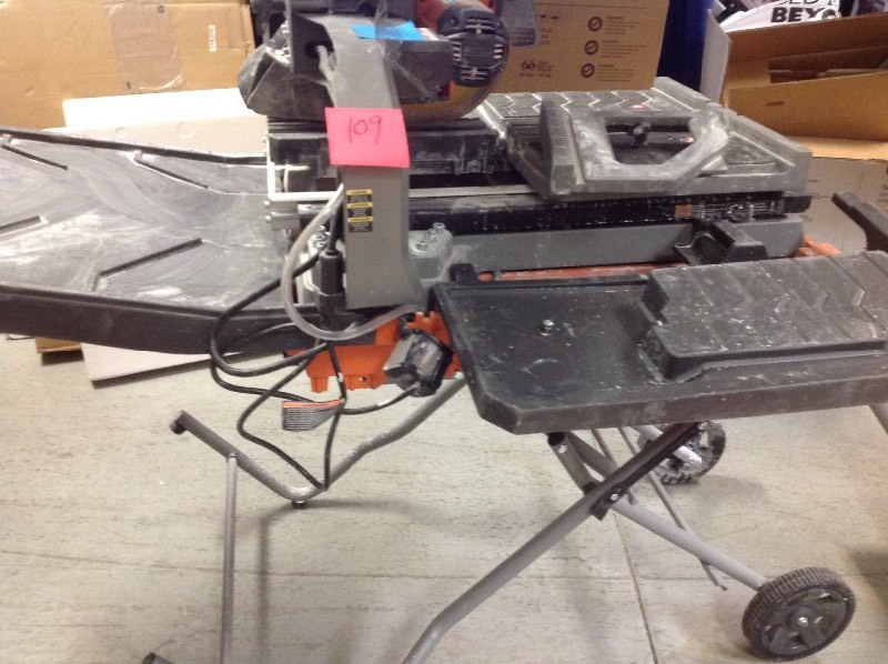 lot 109 image: RIDGID  10 in. Wet Tile Saw with Stand  IN WORKING CONDITIONS