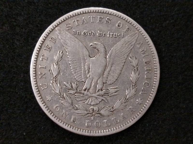 lot 5 image: 1884 S Morgan Silver Dollar...