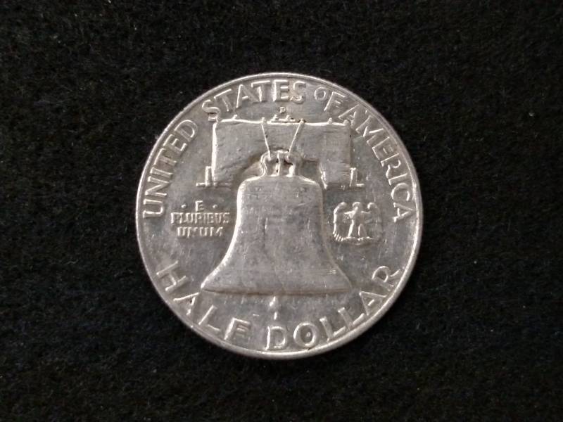 lot 99 image: 1957 D Franklin Silver Half Dollar...