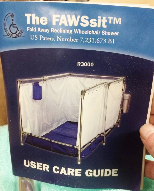 lot 28 image: WOW MSRP $3000 NEW IN BOX&nbspFAWSsit Large Portable Self Contained Indoor&nbspHandicap Wheelchair Safe&nbspFold Away&nbspShower Stall Model R3000 Recliner Size