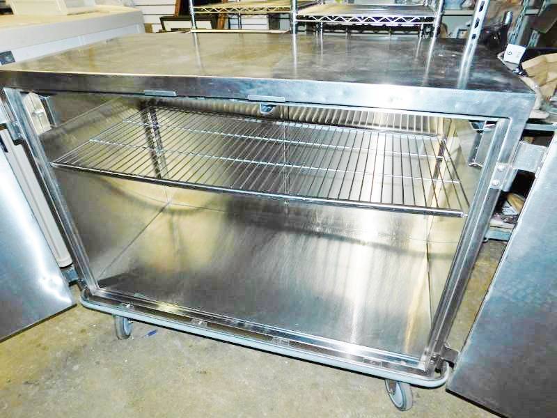 lot 73 image: WOW MSRP $3800 Suburban Heavy-gauge Type 304 Stainless Steel Multi-purpose Mobile 4 Foot Enclosed Case Cart Cabinet With Bumper Guard, Double Door, Locking Wheels, Push Down To Open Knobs & Wire Shelves - Great For Restaurants & More