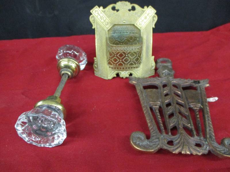 lot 39 image: Brass Holder, Old Glass and brass door knob and hot pad