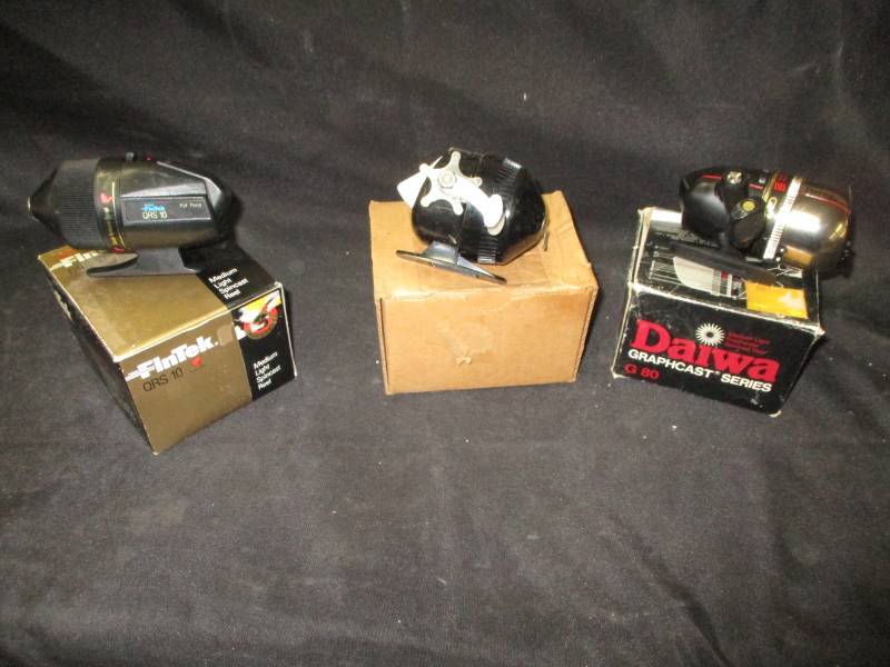 lot 97 image: Fintek Reel Unopened and Daiwa Reel and Zebco Reels all still in boxes and look unused