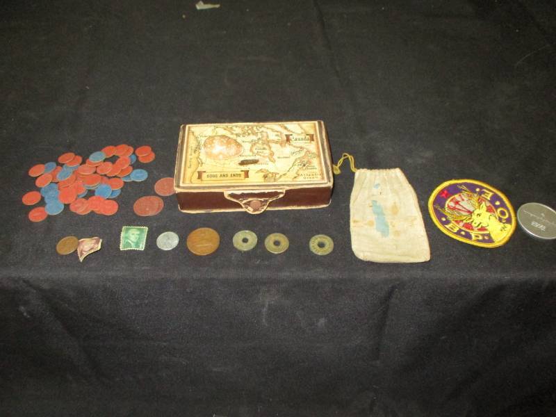lot 106 image: WWII Ration Red and Blue Point Tokens Old Box with Map on it, Michael Retruns March 1995 Coin and Old Stamps 8cent and 1 cent , patch OPA Red and Blue Point Paper coints a shelll and a bagwith a 20 Centovos Coin in it.