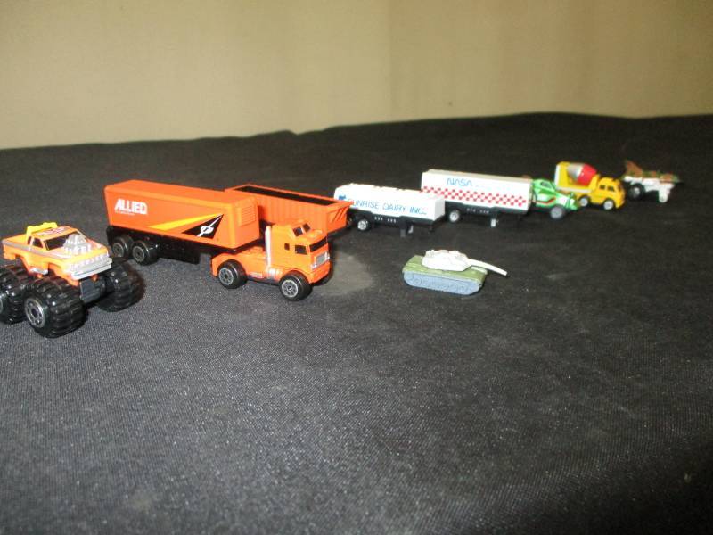 lot 143 image: Micro Machine Allied Movers Orange Truck, 1989 Sunrise Dairy Semi, and So many More see pics