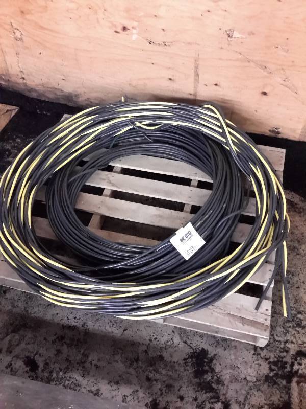 lot 31 image: 4 Coils of Black Wiring,1 Black and Yellow, Coils of Electric Wiring, See Description
