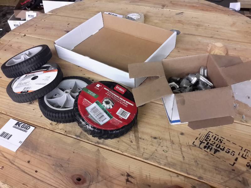 lot 53 image: 4 Mower Wheels, 1 Box of Metal Hooks