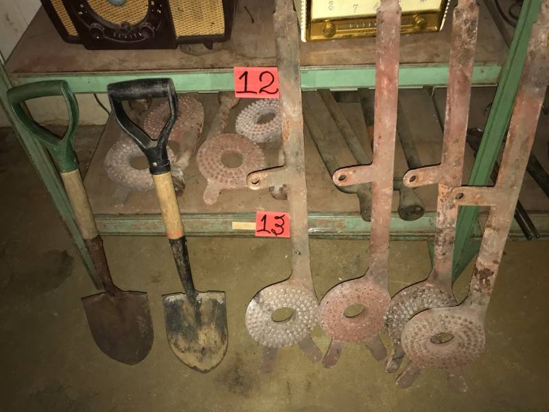 lot 13 image: 2 Pack Shovels & shelf of cast iron objects