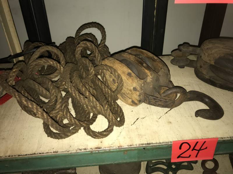 lot 24 image: Two Antique Wood Pulleys with rope