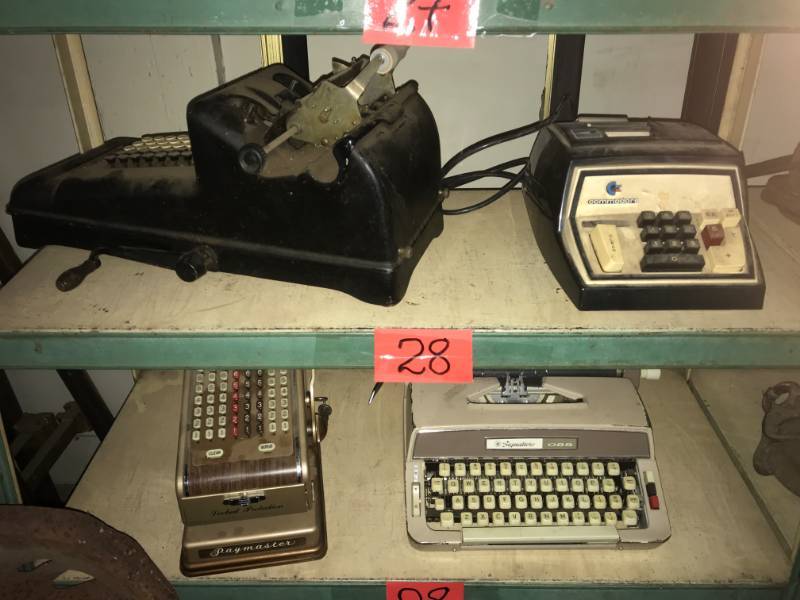 lot 28 image: Two shelves of vintage machines