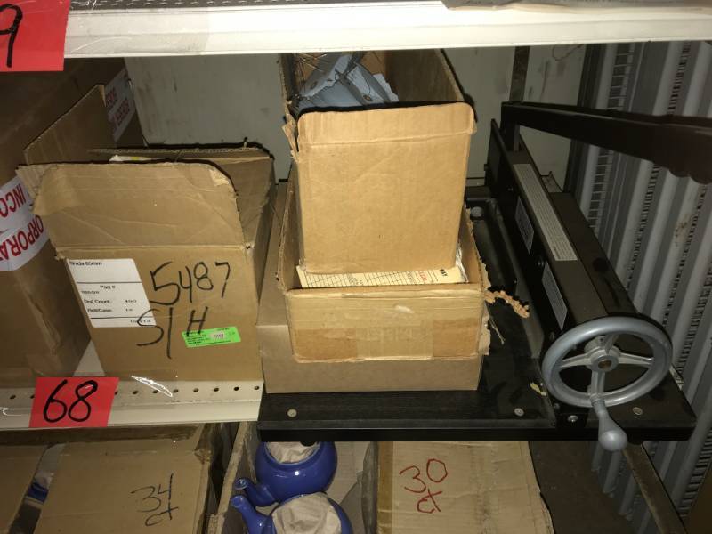 lot 68 image: Shelf of misc paper products and heavy duty paper cutter
