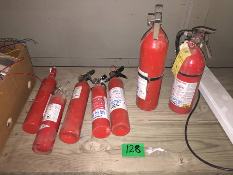 lot 128 image: Seven Fire Extinguishers