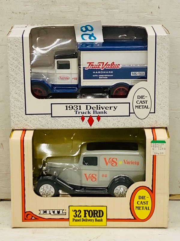 lot 28 image: (2) Die-Cast Delivery Trucks