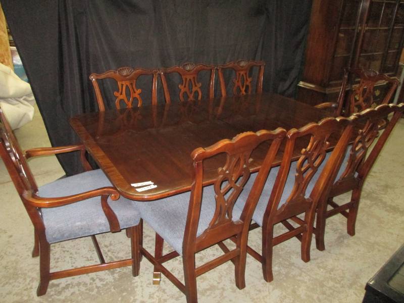 Beautiful table with 8 chairs and 2 20 leaveds in sleeves and table cover pad