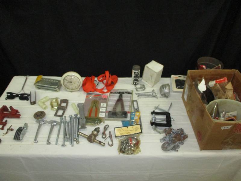 little bench vice, safe handle and possible brass ground clamp and Various old hardware and vintage stuff and carriage bolts brackets