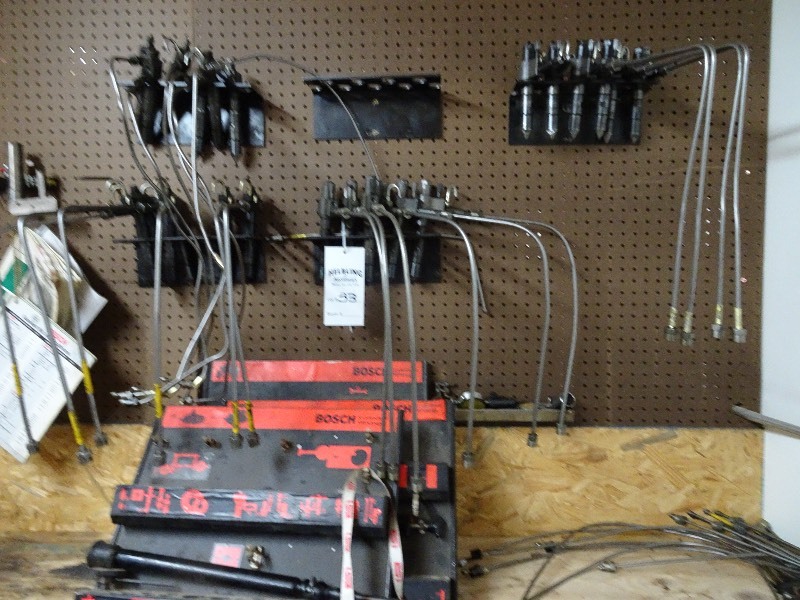 Injector display and injectors on pegboard and bench