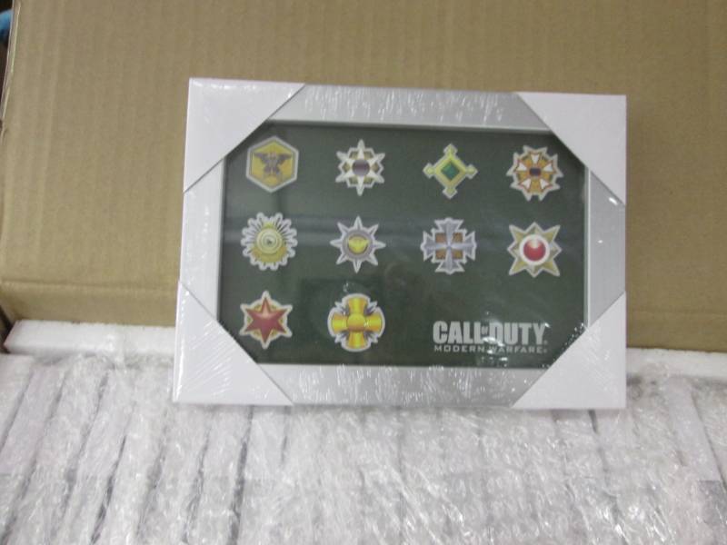 lot 89 image: Case of 40 Call of Duty Photo Metal...