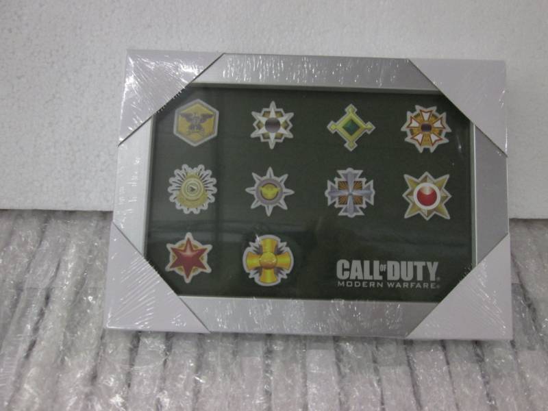 lot 92 image: Case of 40 Call of Duty Photo Metal...