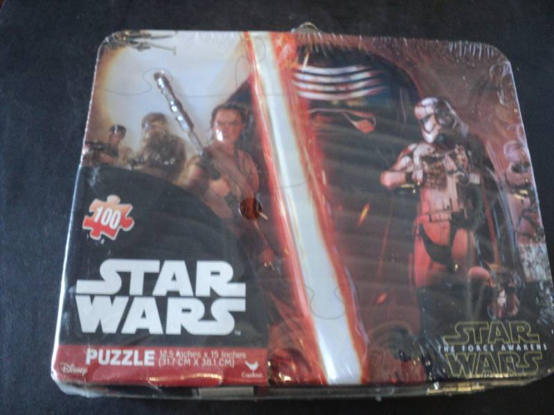 lot 19 image: Star Wars Puzzle in a Lunch Box...