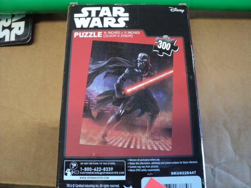 lot 57 image: Star Wars Puzzle and Light Saber...