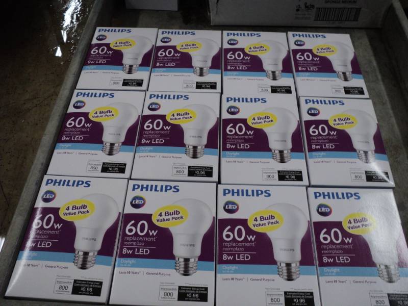 lot 66 image: 12 Philips 4 packs of LED 60 W Ligh...
