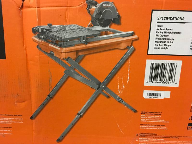 lot 23 image: RIDGID 7 in. Tile Saw with Stand in good working condition