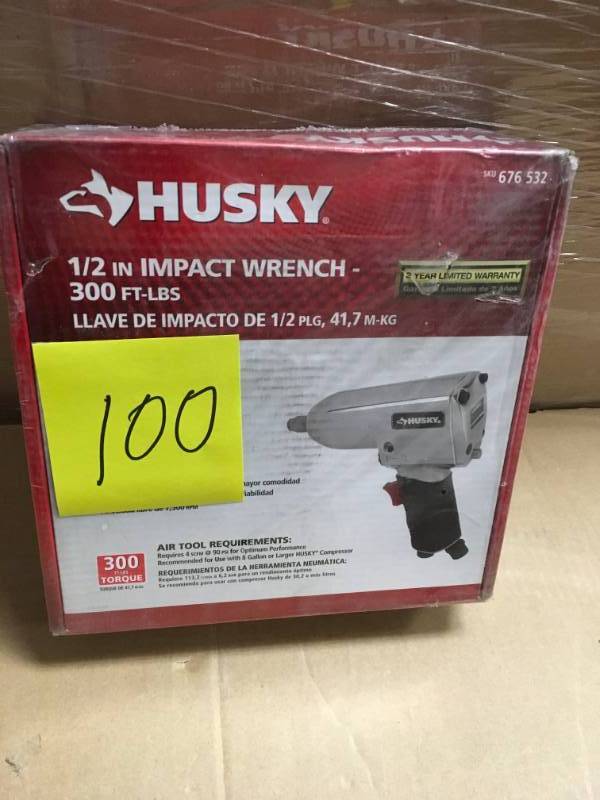 lot 100 image: Husky 12 in. 300 ft. lbs. Impact Wrench in good working condition