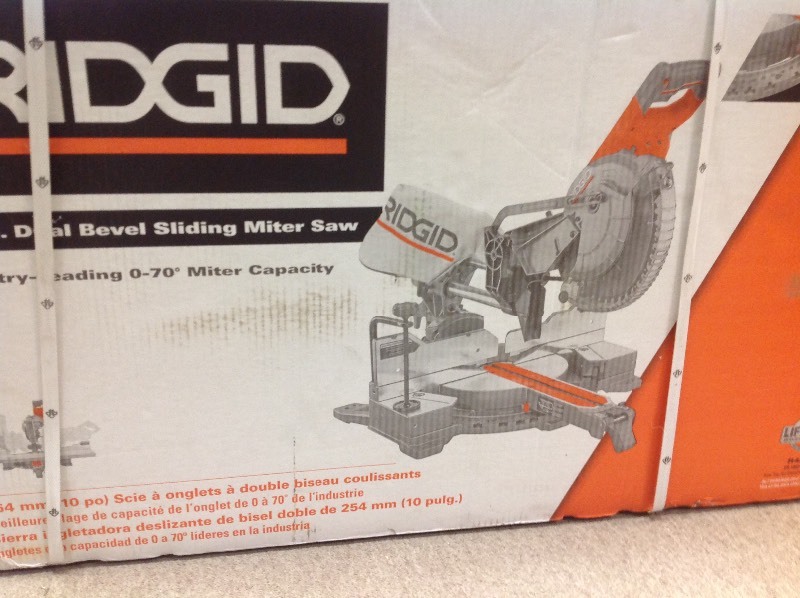 lot 101 image: RIDGID R4210 10 Sliding Dual Bevel Miter Saw with Dual Laser Guide in good working conditions