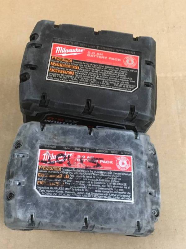 lot 79 image: ONE Milwaukee M18 18-Volt Lithium-Ion XC5.0 Extended Capacity Battery Pack & ONE Milwaukee M18 18-Volt Lithium-Ion 2.0 Ah Compact Battery USED  in good working condition