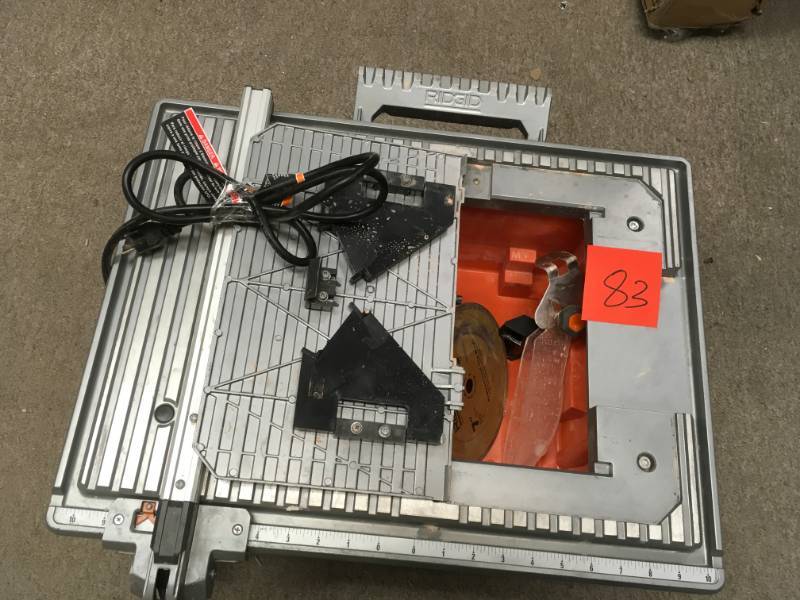 lot 83 image: RIDGID 6.5 Amp Corded 7 in. Table Top Wet Tile Saw USED in good working condition