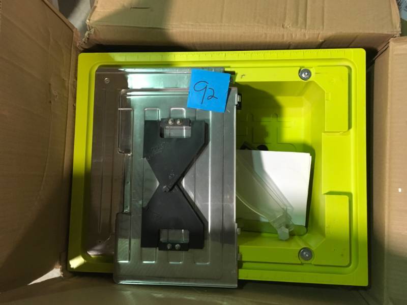 lot 92 image: RYOBI 7 in. 4.8 Amp Tabletop Tile Saw in very good condition