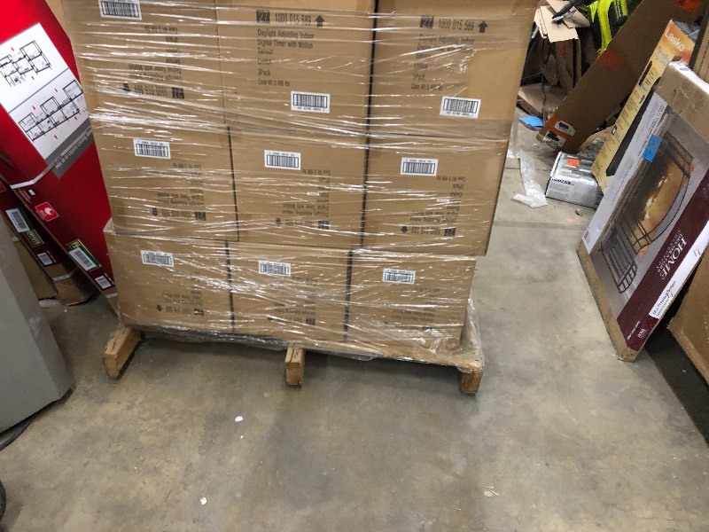 lot 112 image: pallet of 45 cases of Defiant 8 Amp 7-Day Indoor In-Wall SunSmart Digital Timer Switch with Motion Sensor, White 3 pc for case 145 pc retail $ 4725 All NEW