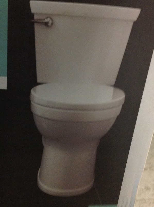 lot 101 image: American Standard Champion 4 HET Tall Height 2-piece 1.28 GPF High-Efficiency Elongated Toilet in White, Seat Not Included in good conditions