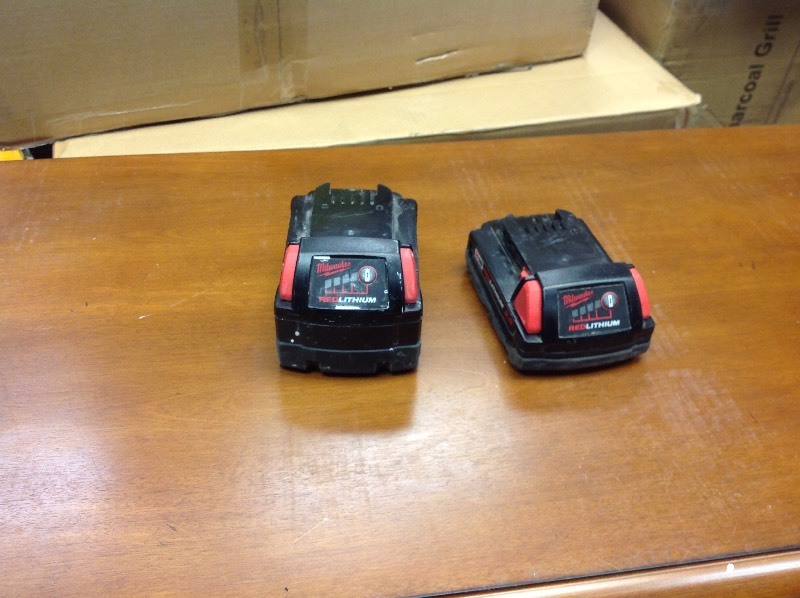 lot 104 image: Set of 1 Milwaukee M18 18-Volt Lithium-Ion XC Extended Capacity Battery 3.0 Ah and 1 Milwaukee M18 18-Volt Lithium-Ion Compact Battery 2.0 Ah in working conditions