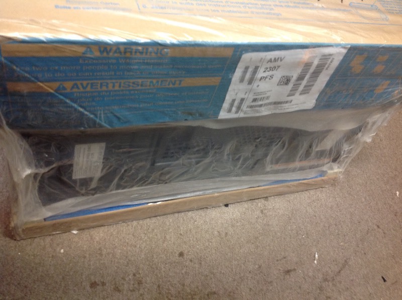 lot 108 image: Amana 1.6 cu. ft. Over the Range Microwave in Stainless Steel in working conditions