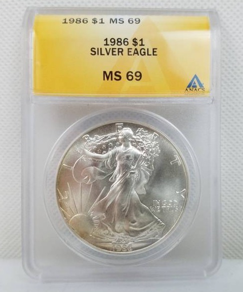 lot 32 image: 1986 Silver Eagle Dollar MS 69