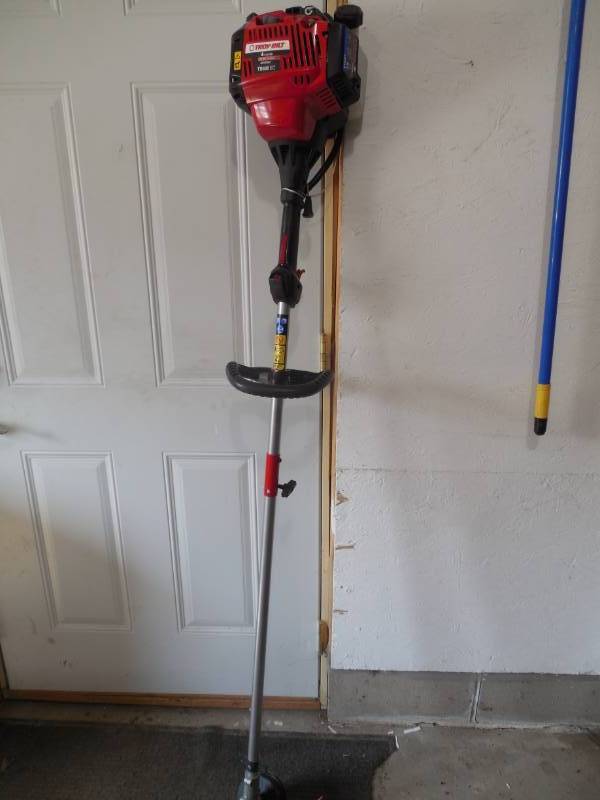 lot 63 image: Troy-Bilt 30 cc 4-Cycle Straight Shaft Attachment Capable Gas Trimmer with JumpStart Capabilities