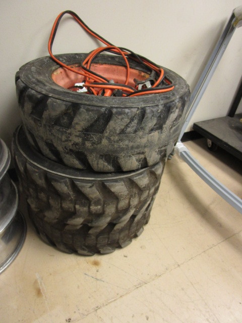 BOBCAT TIRES AND JUMPER CABLES