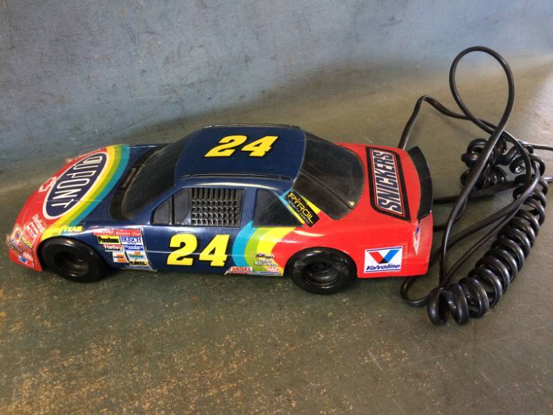 lot 66 image: NASCAR Memorabilia with Unopened Card Packs, Vintage Earnhardt Team Card & Gordon Car Touch Tone Phone