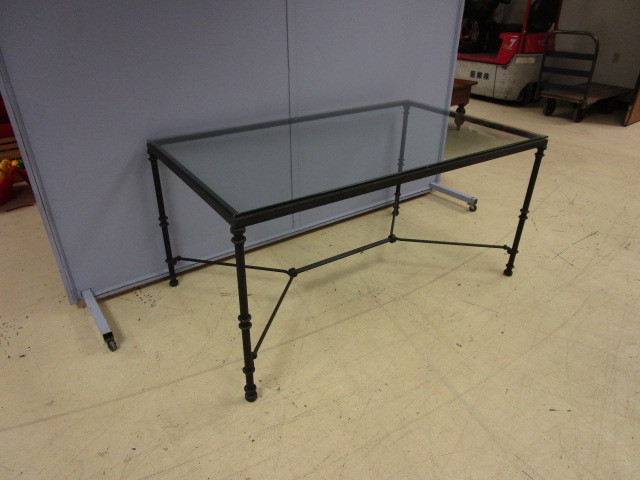 lot 444 image: GLASS AND CAST IRON TABLE