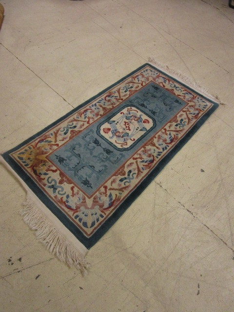 lot 446 image: SMALL WOOL RUG